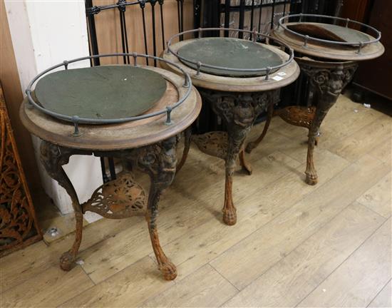 Three Victorian circular topped pub tables with cast iron bases W.61cm